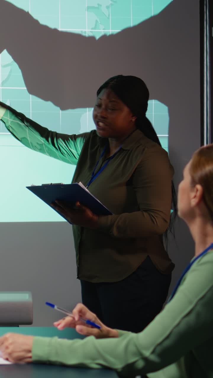 Vertical Video Black business advisors revealing monthly data insights during briefing