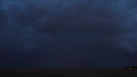 ominous dark storm clouds over a field