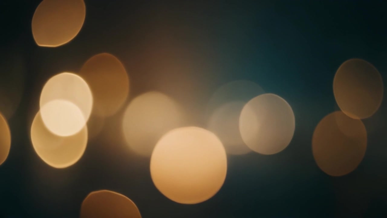 Abstract Background of Glowing Golden Bokeh Lights