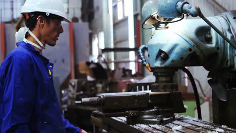 male engineer working on a machine 4k