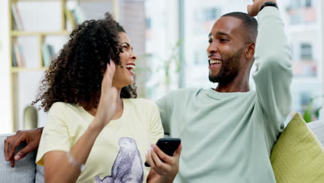 Couple,-high-five-and-celebration-with-phone