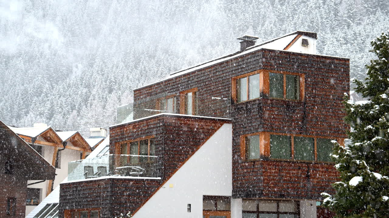 View of multiple ski cabins while snowing in the Dolomites, Italy