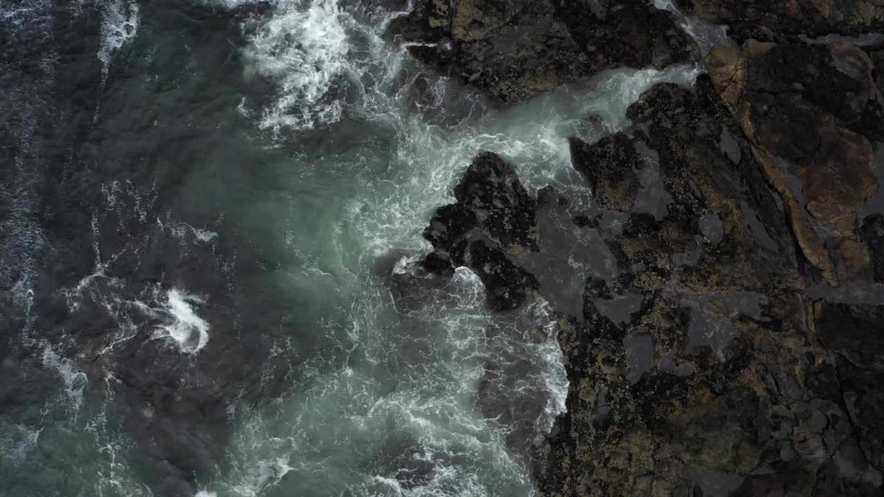 Overhead View Of A Sea Waves Over Rugged Shoreline