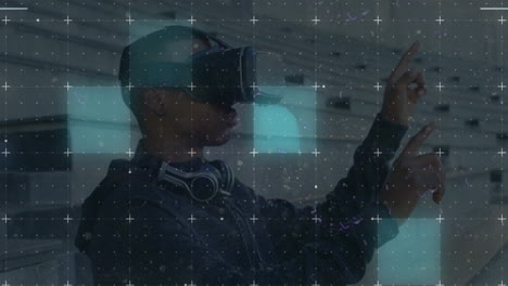 light trails over grid network against african american man wearing vr headset at office