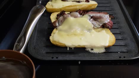 A-classic-french-dip-pulled-out-of-the-oven-after-allowing-the-cheese-to-properly-melt