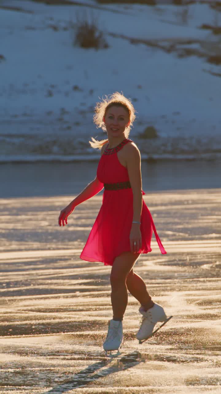 Graceful Young Ice Skater in a Vibrant Pink Dress Performing Artistic Spins Against a Stunning Frozen Lake Backdrop as the Sun Shines Brightly, Capturing the Joy of Winter Sports and Elegance on Ice