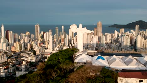 Aerial-view-of-christ-the-redeemer-in-Brazil-with-the-city-and-ocean-in-the-background