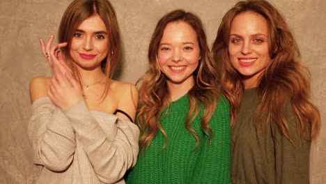 three women friends posing for a photo