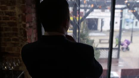 businessman looking out a window