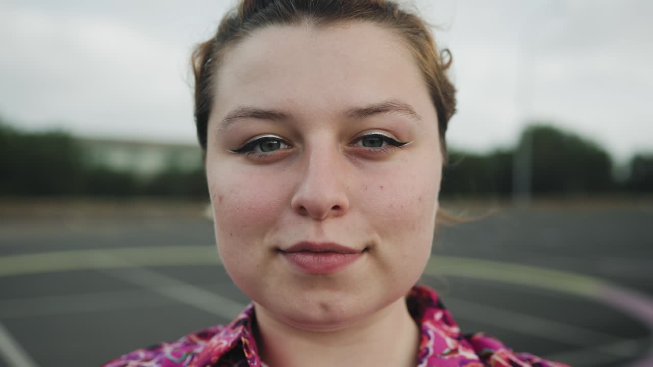 Happy teenager looking at camera outdoor