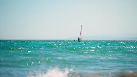 wind and kite surfers near the coast of spain