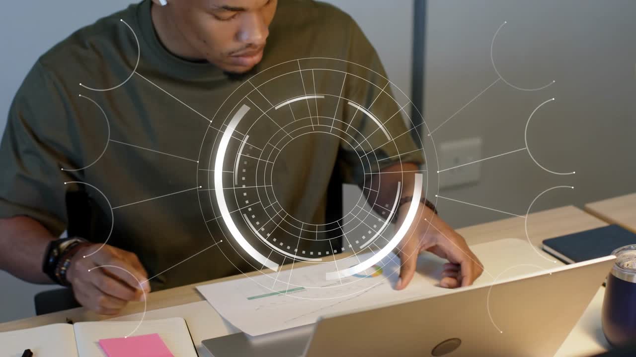 Analyst noting, reaching for chart, reviewing business report for insights while HUD showing data