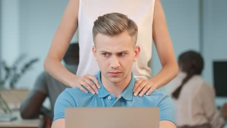 closeup woman hands making massage to man. shocked man asking to stop harassment