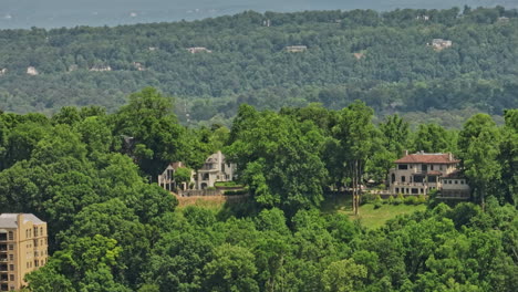 birmingham alabama aerial v32 tracking shot along hillcrest across redmont park wooded residential neighborhood capturing various historic architectures and homes - shot with mavic 3 cine - may 2022