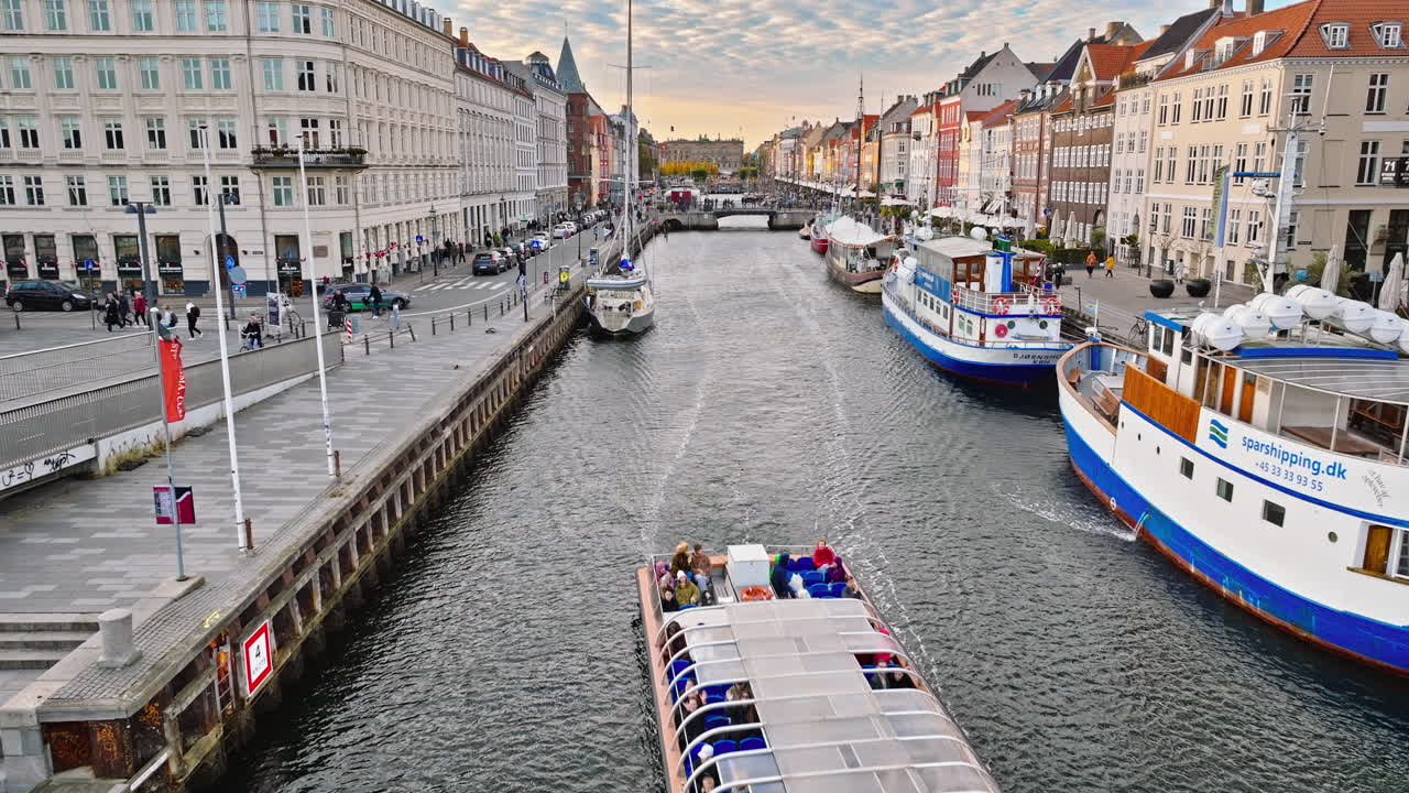 Copenhagen, Denmark - October 24, 2024: Aerial drone view of the Nyhavn waterfront, canal and entertainment district in daylight