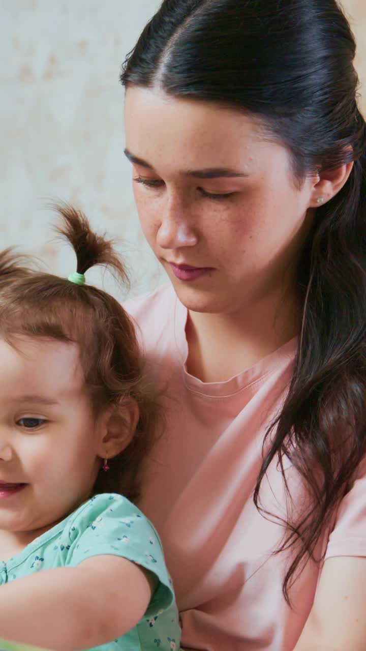 A Tender Moment: A Caring Mother Engaging with Her Curious Child in a Warm and Loving Environment Capture the Joy of Parenting and Connection