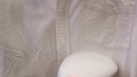 ironing a white button-down shirt