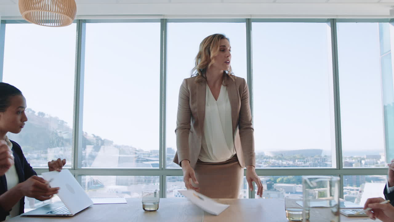 beautiful business woman team leader discussing creative ideas with shareholders briefing colleagues sharing company development strategy in office boardroom meeting 4k