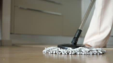 woman mopping kitchen floor