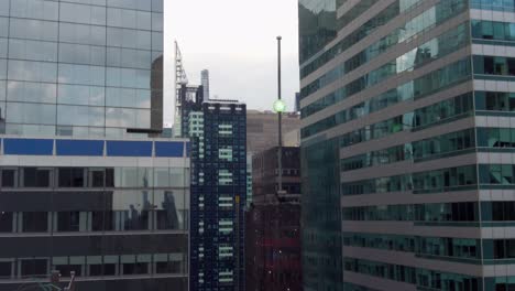 Aerial-birds-eye-overhead-top-down-view-of-tall-office-of-apartment-buildings