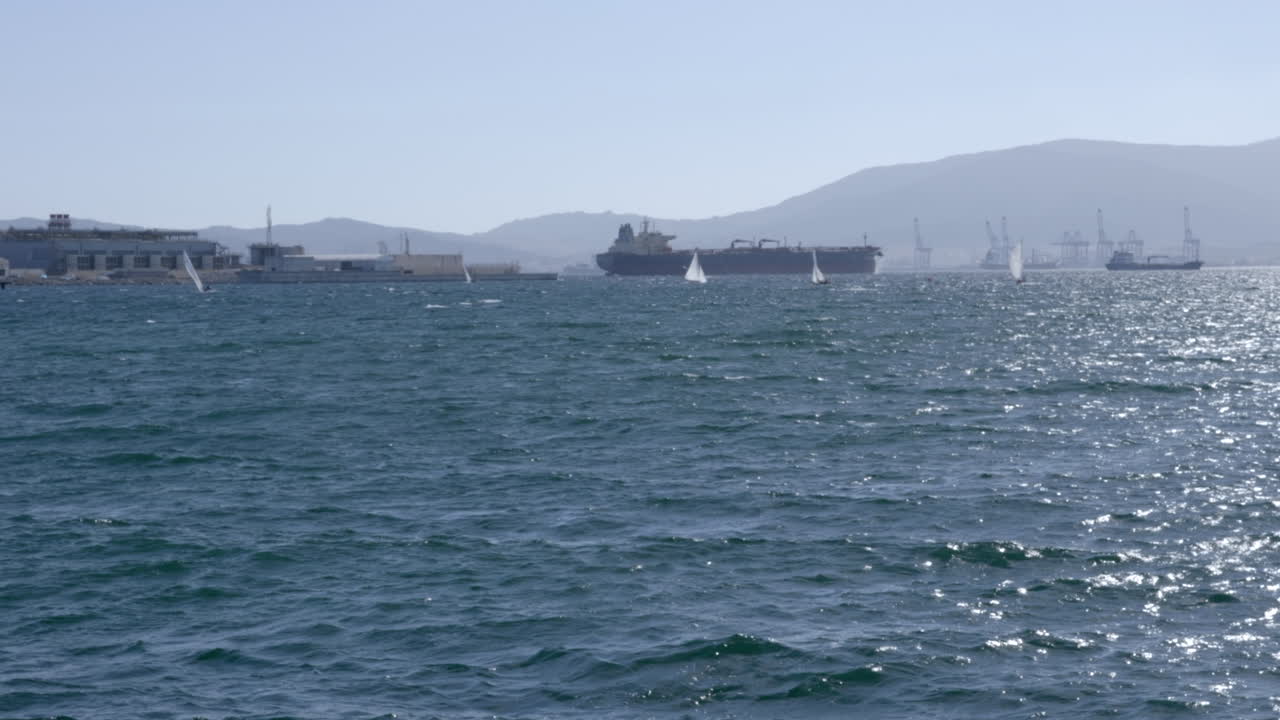 View of moored boats, sailboats and the airstrip in Gibraltar in Algeciras bay