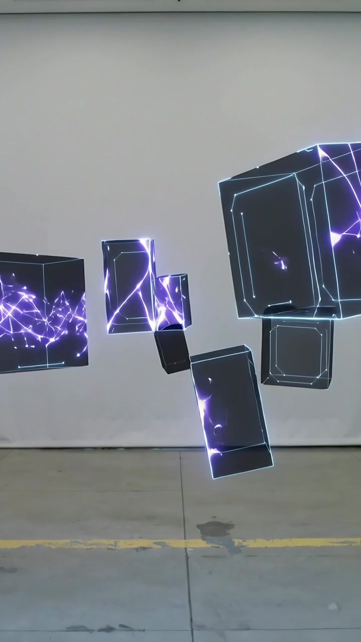 Vertical video: Drifting boxes after animation in studio, flashing purple, person left in dark top