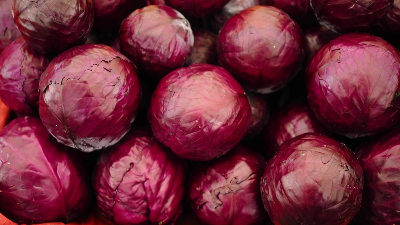 Fresh Red Cabbage Heads Displayed at a Market