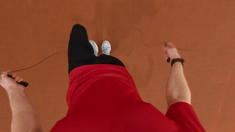 overhead view of a person exercising with a jumping rope