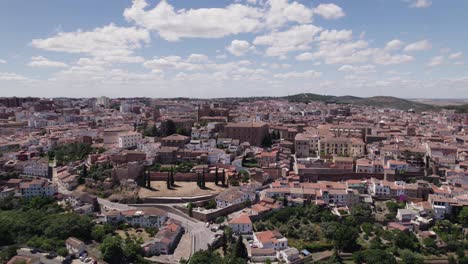 Aerial:-broad-view-of-Old-Town-of-Cáceres-on-a-sunny-day,-Spain