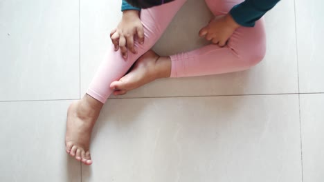 child girl suffering from itching skin, close up