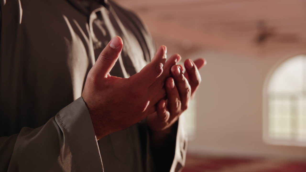 Muslim man praying in a mosque