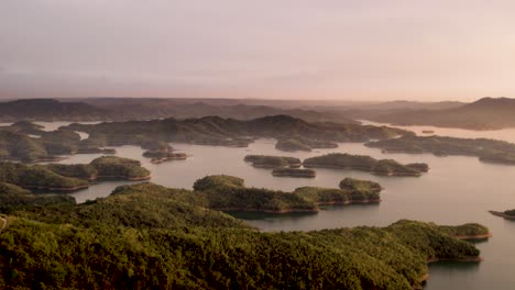 Sunset-at-Tà-Đùng-in-Vietnam,-Asia,-a-lake-with-a-river-and-a-scenic-island-archipelago