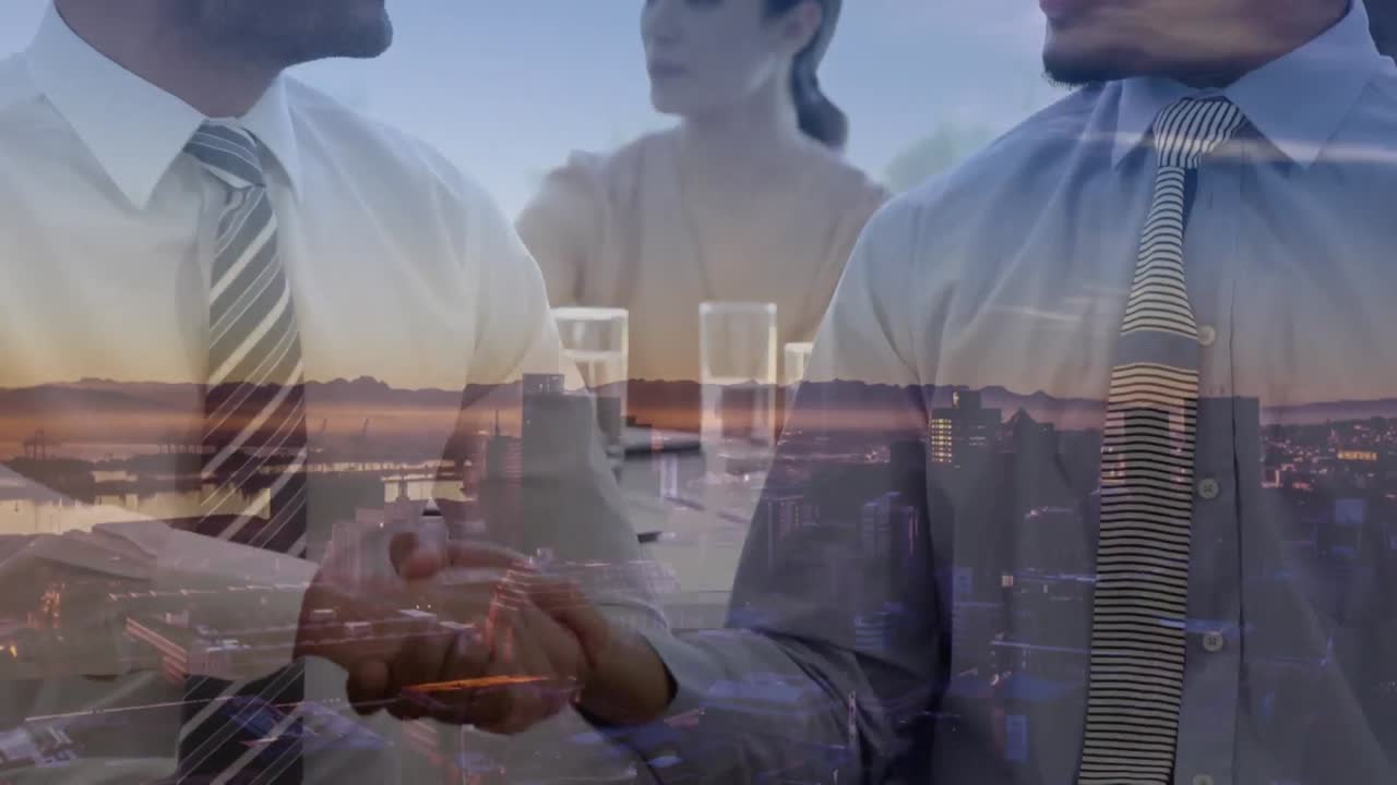 다양한 사업가들이 사무실에서 손을 흔들고 있는 디지털 구성 도시 풍경의 공중 전망