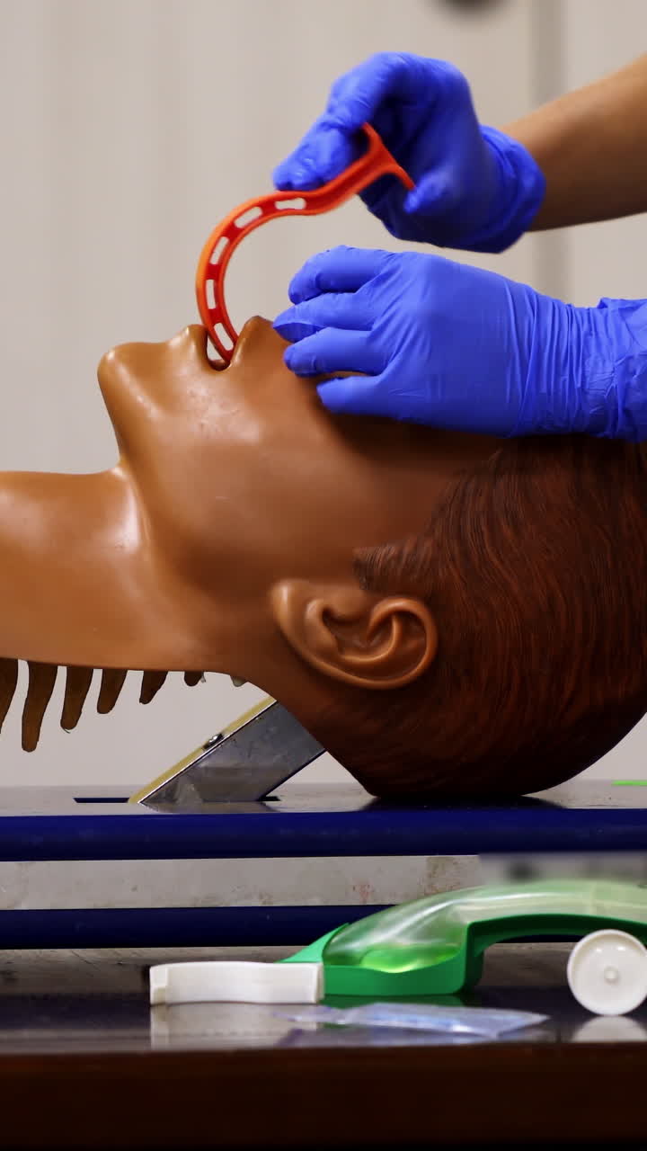 Emergency training for save life. Demonstrating chest compression on CPR doll. Vertical video