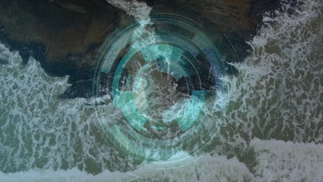 futuristic digital hud overlay floating above rocky coastline showing data rings and ocean patterns