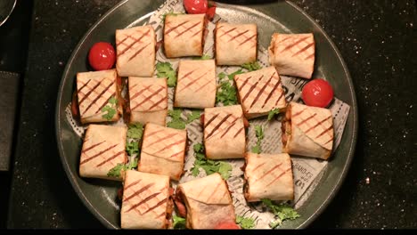 chicken shawarma pieces stuffed with barbecue sauce under a hot plate