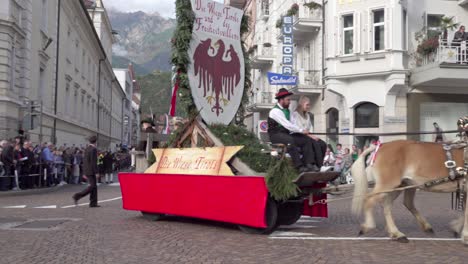 Carriage pulled by a horse during the grape festival parade in Meran - Merano, South Tyrol, Italy