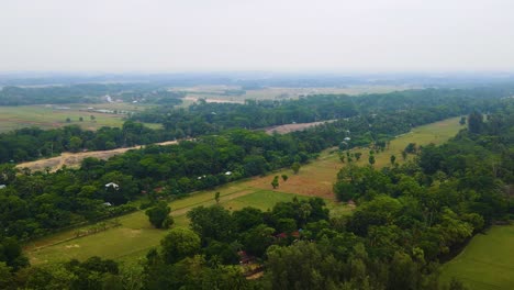panoramic aerial view of lush green nature surroundings over countryside town