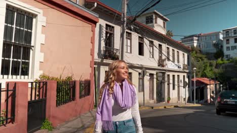 young blonde caucasian girl walking towards camera looking