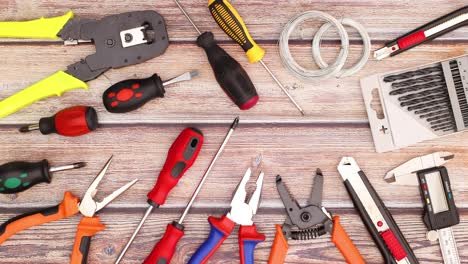 construction and diy tools move on wooden working table - stop motion