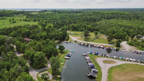 boats and sailing yachts moored in a marina - aerial drone shot