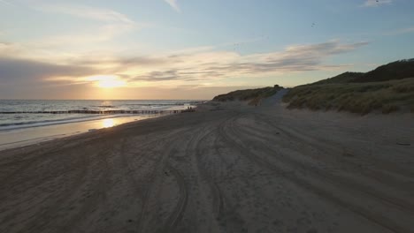 aerial: the beach between vlissingen and dishoek during sunset