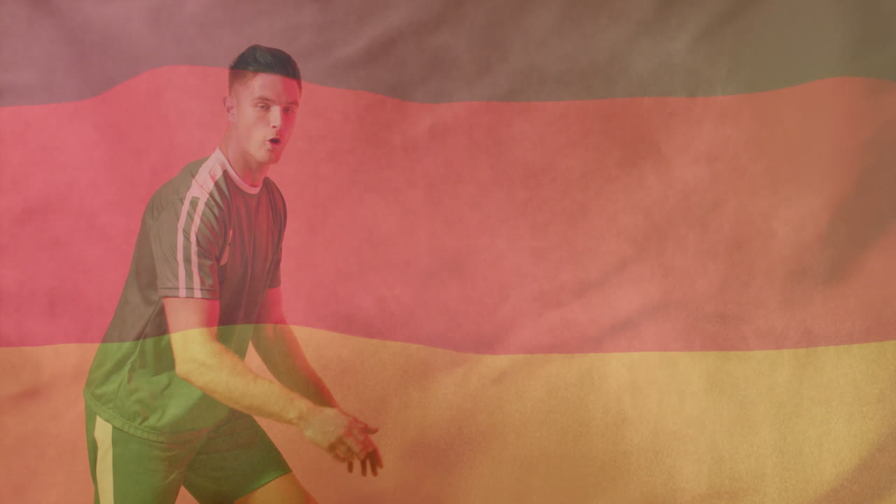 Animazione della bandiera della Germania su un calciatore maschio caucasico che calcia il pallone.