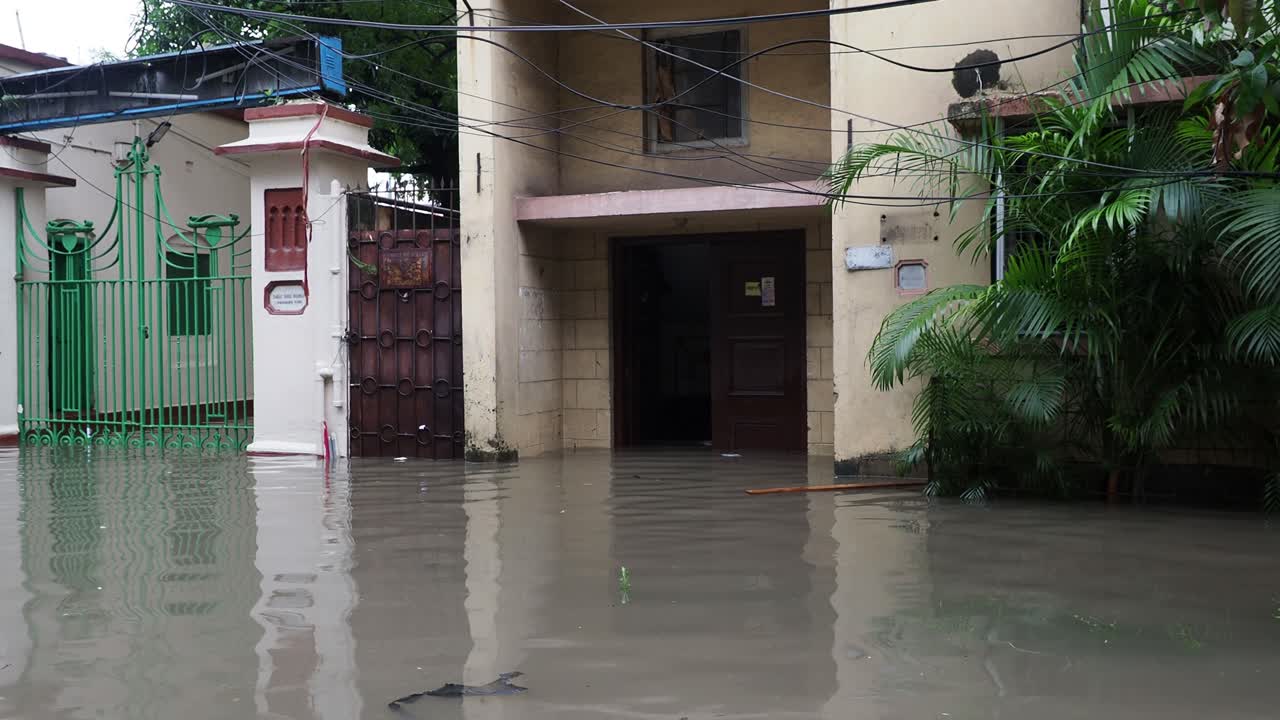 Buildings and houses are submerged in water. Rain water logged road, due to Super cyclone Amphan. The devastation has made many damages to West Bengal state.