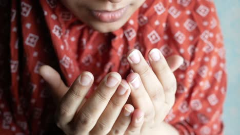 unrecognized muslim women hand praying at ramadan