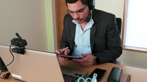 documenting project milestones on tablet