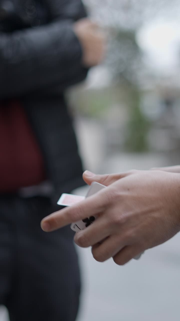 Close-up Shots of Hands Manipulating Playing Cards