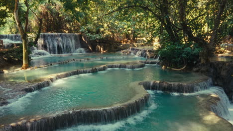 beautiful turquoise waterfalls cascading through a lush jungle