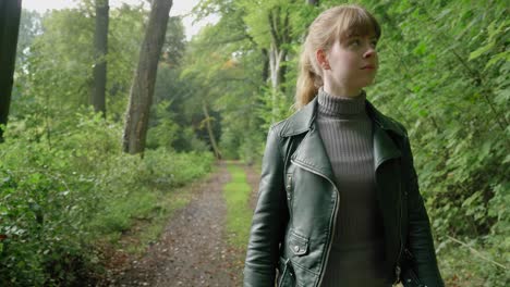 youngs stylish woman walks nature path, tracking