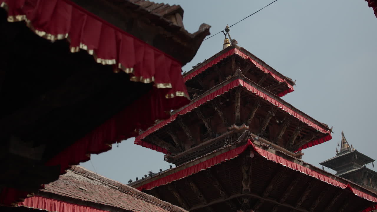 Nepal’s ancient architecture in the heart of Kathmandu Valley reflects cultural harmony and peace. Temples surrounded by pigeons symbolize serenity, spirituality, and Nepal’s timeless heritage